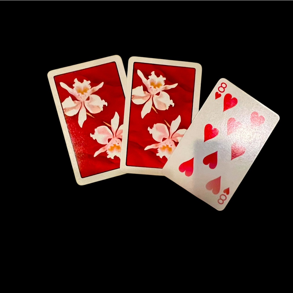Vintage deck of playing cards with beautiful orchids